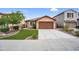 Charming single-Gathering home with a well-manicured front yard, a covered entry, and a two-car garage at 7070 W Andrea Dr, Peoria, AZ 85383