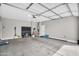 Spacious three-car garage with ample storage space and high ceilings at 7070 W Andrea Dr, Peoria, AZ 85383