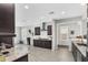 Open kitchen with granite countertops, stainless steel appliances, and an eat-in island at 7070 W Andrea Dr, Peoria, AZ 85383