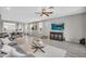 Bright living room featuring neutral colors, a ceiling fan, and an adjacent dining area at 7070 W Andrea Dr, Peoria, AZ 85383