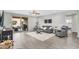 Open living room features modern décor, plush seating, an open floor plan, and patio access at 7070 W Andrea Dr, Peoria, AZ 85383