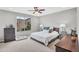 Cozy main bedroom features a large window, neutral tones, and ample space at 7070 W Andrea Dr, Peoria, AZ 85383