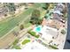 Aerial view of neighborhood with golf course and community pool nearby at 7252 E Edgewood Ave, Mesa, AZ 85208