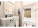 Traditional bathroom showcasing vanity with sink and a tub-shower combination at 7252 E Edgewood Ave, Mesa, AZ 85208