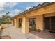 Inviting covered patio space with tiled flooring and gated entry, perfect for enjoying the outdoors in privacy at 7252 E Edgewood Ave, Mesa, AZ 85208