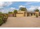 Spacious home featuring a large driveway, a two-car garage, and secure gated access for enhanced privacy at 7252 E Edgewood Ave, Mesa, AZ 85208