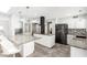 Open kitchen with granite countertops, an island, and stainless steel appliances at 7252 E Edgewood Ave, Mesa, AZ 85208
