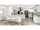 Modern kitchen features granite countertops, stainless steel appliances, and white cabinetry at 7252 E Edgewood Ave, Mesa, AZ 85208