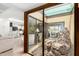 Bright living room with a serene indoor garden view, enhancing the space's tranquility and natural light at 7252 E Edgewood Ave, Mesa, AZ 85208