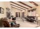 Comfortable living room with vaulted ceilings, wooden beams, and an open layout perfect for relaxation and entertaining at 7252 E Edgewood Ave, Mesa, AZ 85208