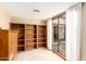 Reading area with custom bookshelves and natural light at 7252 E Edgewood Ave, Mesa, AZ 85208