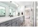 Modern bathroom with double vanity, sleek fixtures, and a separate tub at 7252 E Edgewood Ave, Mesa, AZ 85208