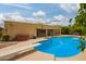 Backyard featuring a diving pool, a spa and a covered patio at 7252 E Edgewood Ave, Mesa, AZ 85208