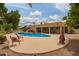 Backyard oasis showcasing a pool, a hot tub and ample seating areas for entertaining at 7252 E Edgewood Ave, Mesa, AZ 85208