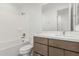 Bathroom featuring modern vanity with sleek countertop and a tiled shower and bathtub combination at 7342 W Hedge Hog Pl, Peoria, AZ 85383