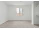 Bright bedroom with white walls, neutral carpet and features a window and closet with built in shelving at 7342 W Hedge Hog Pl, Peoria, AZ 85383