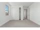 Bedroom features carpet floors, a closet with sliding doors, and access to the bathroom at 7342 W Hedge Hog Pl, Peoria, AZ 85383