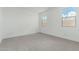Carpeted bedroom with natural light streaming through two windows at 7342 W Hedge Hog Pl, Peoria, AZ 85383