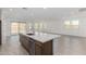 Open-concept kitchen and dining area with stainless steel appliances, island sink, and recessed lighting at 7342 W Hedge Hog Pl, Peoria, AZ 85383