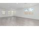 Spacious living room with bright natural light and neutral tile flooring throughout at 7342 W Hedge Hog Pl, Peoria, AZ 85383