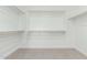 A spacious walk-in closet featuring ample shelving and clothing rods for organized storage at 7342 W Hedge Hog Pl, Peoria, AZ 85383