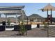 A playground featuring various play structures surrounded by desert landscaping at 7674 W Rowel Rd, Peoria, AZ 85383