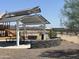 A playground offers a picnic shelter and play area surrounded by desert landscaping and mountain views at 7674 W Rowel Rd, Peoria, AZ 85383