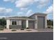 Charming single-story home featuring a three-car garage and low maintenance desert landscaping at 7674 W Rowel Rd, Peoria, AZ 85383