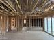 Interior shot shows exposed wood framing, ductwork, and electrical and plumbing lines installed at 7674 W Rowel Rd, Peoria, AZ 85383