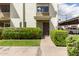 Inviting front entrance with well-maintained landscaping and a charming, painted brick facade at 7740 E Heatherbrae Ave # 13, Scottsdale, AZ 85251