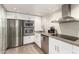 Bright kitchen features stainless steel appliances, concrete countertops, and sleek cabinetry at 7740 E Heatherbrae Ave # 13, Scottsdale, AZ 85251