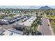 Scenic aerial view of the residences, with lake, mountains and carport parking at 8113 E Vista Dr, Scottsdale, AZ 85250