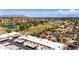 Aerial view of community, nearby park, aquatic center, and beautiful mountain views at 8113 E Vista Dr, Scottsdale, AZ 85250
