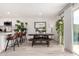 Open concept dining area with kitchen island, barstools and bench seating is great for entertaining at 8113 E Vista Dr, Scottsdale, AZ 85250