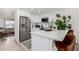 Contemporary kitchen features white cabinets, stainless steel appliances, and quartz countertops at 8113 E Vista Dr, Scottsdale, AZ 85250