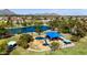 Community playground and lake with play structures, picnic pavilions, and mature trees at 8113 E Vista Dr, Scottsdale, AZ 85250