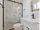 Bathroom with glass enclosed shower with black hardware, and new vanity at 8132 W Earll Dr, Phoenix, AZ 85033