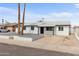 Charming single-story home featuring a minimalist front yard, a well-manicured lawn, and a welcoming entrance at 8132 W Earll Dr, Phoenix, AZ 85033