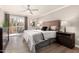 Bright bedroom featuring a balcony with sliding glass door and modern ceiling fan at 8250 E Arabian Trl # 120, Scottsdale, AZ 85258