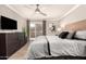 Bright bedroom with a large dresser, a ceiling fan and private balcony at 8250 E Arabian Trl # 120, Scottsdale, AZ 85258