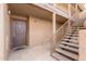 Exterior view of a well-maintained apartment entrance with a secure front door at 8250 E Arabian Trl # 120, Scottsdale, AZ 85258