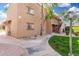 Attractive apartment building exterior featuring landscaped grounds and well-lit pathways at 8250 E Arabian Trl # 120, Scottsdale, AZ 85258