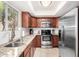 Well-maintained kitchen with modern appliances and granite countertops at 8250 E Arabian Trl # 120, Scottsdale, AZ 85258