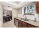 Bright kitchen with granite countertops and stainless steel dishwasher at 8250 E Arabian Trl # 120, Scottsdale, AZ 85258