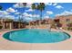 Resort-style pool area surrounded by lush landscaping and comfortable lounge chairs at 8250 E Arabian Trl # 120, Scottsdale, AZ 85258