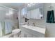 Bathroom featuring a sink, vanity, toilet, and shower at 111 S Greenfield Rd # 670, Mesa, AZ 85206