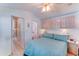 Comfortable bedroom with built-in storage and a calming blue comforter set at 111 S Greenfield Rd # 670, Mesa, AZ 85206