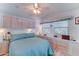 Comfortable bedroom with built-in storage, soft lighting, and a plush bed with pillows at 111 S Greenfield Rd # 670, Mesa, AZ 85206