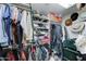 Walk-in closet featuring ample storage space and lots of clothing at 111 S Greenfield Rd # 670, Mesa, AZ 85206