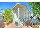Exterior view of a home featuring a covered patio, garden, and outdoor seating at 111 S Greenfield Rd # 670, Mesa, AZ 85206